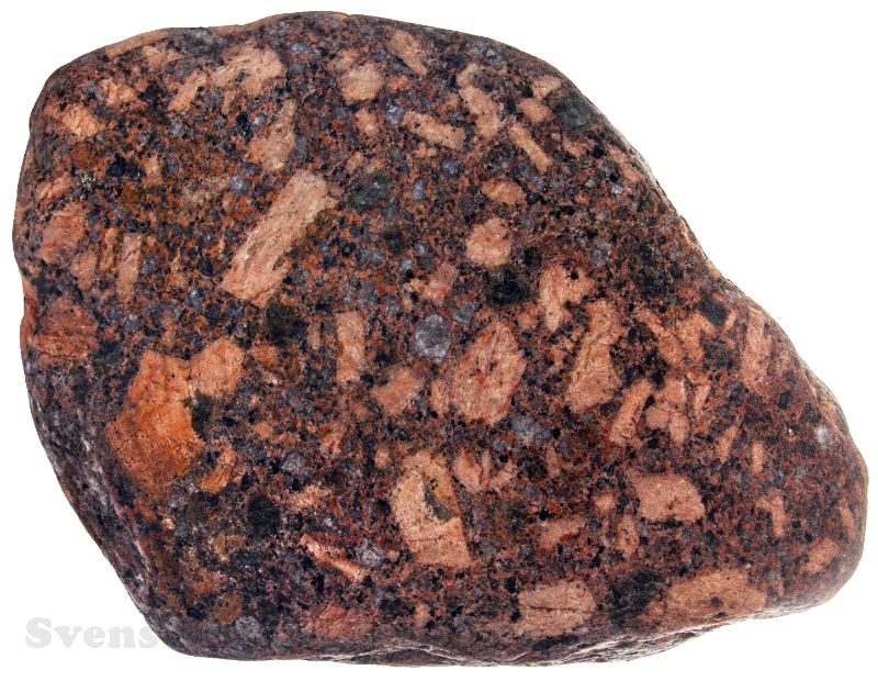 FY-210.jpg - Finsk granitporfyr - 27 cm. En grov sten med både rektangulære og runde kalifeldspatmegakryster i en granittisk grundmasse. Stammer formentlig fra det finske fastland, men det er næppe muligt, at stedfæste den nøjagtigt.
